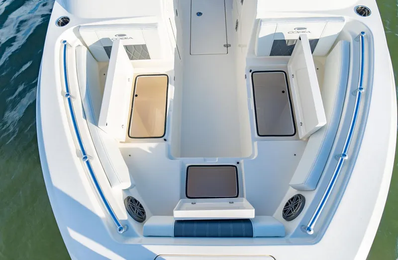 Slide: The Image of Manufacturer Provided Image: 2025 Cobia 220 Dual Console boat interior with storage compartments and seating. - 5