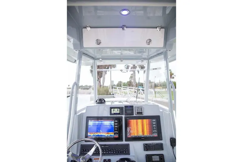 Slide: The Image of Manufacturer Provided Image: 2025 Cobia 320 Center Console dashboard with advanced navigation displays. - 12