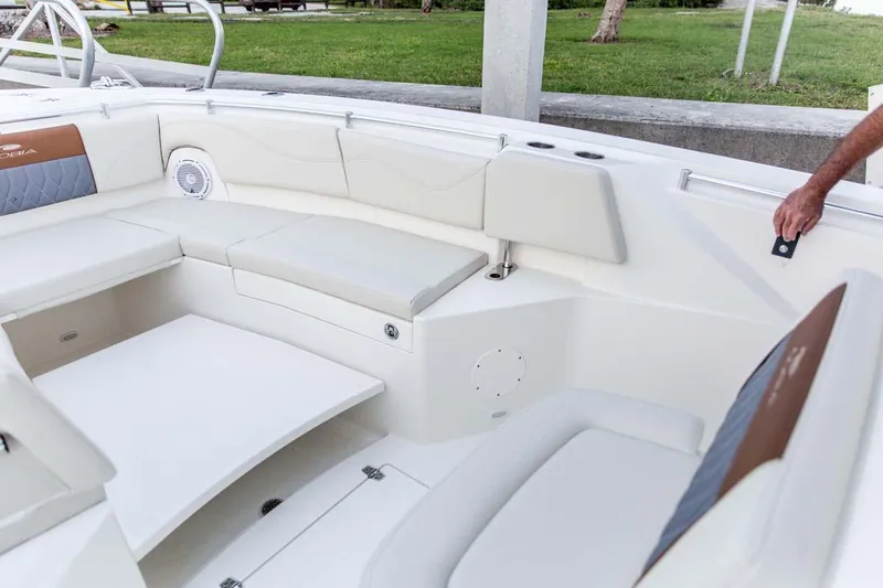 Slide: The Image of Manufacturer Provided Image: 2025 Cobia 320 Center Console boat interior with white seating and modern design. - 14