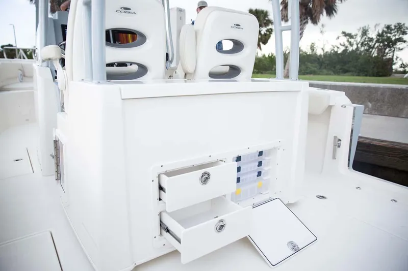 Slide: The Image of Manufacturer Provided Image: 2025 Cobia 320 Center Console boat with open storage compartments. - 15