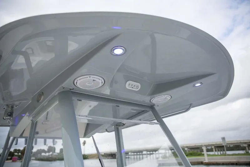 Slide: The Image of Manufacturer Provided Image: 2025 Cobia 320 Center Console boat roof with built-in lights and speakers. - 5