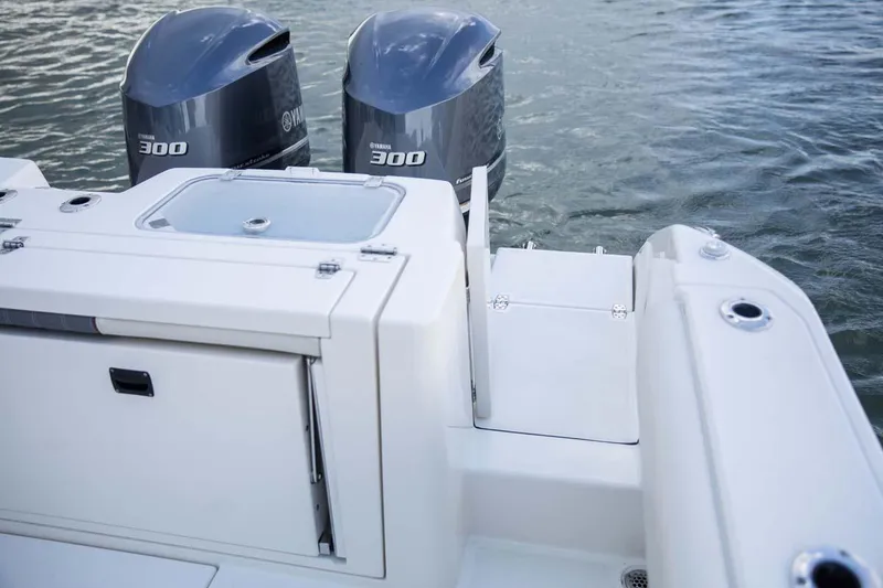 Slide: The Image of Manufacturer Provided Image: 2025 Cobia 320 Center Console boat with twin 300 engines on water. - 7