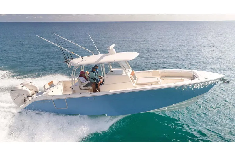 The Image of Manufacturer Provided Image: 2025 Cobia 350 Center Console boat cruising on open water. - 0