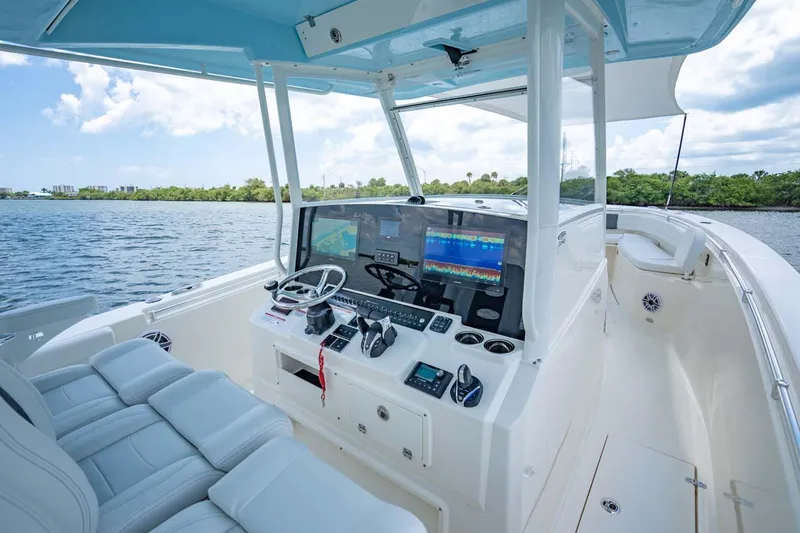 Slide: The Image of Manufacturer Provided Image: 2025 Cobia 350 Center Console boat interior with advanced navigation system. - 10