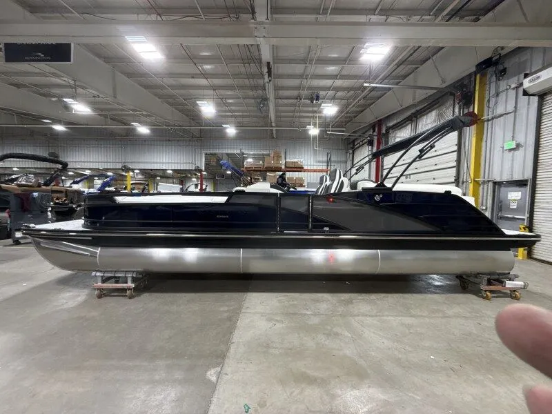 The Image of 2026 Bennington 25RTFB pontoon boat in warehouse. - 1