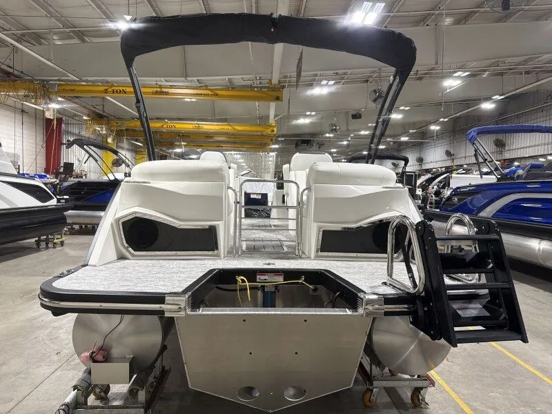 Slide: The Image of Bennington 25RTFB 2026 pontoon boat in a manufacturing facility. - 14