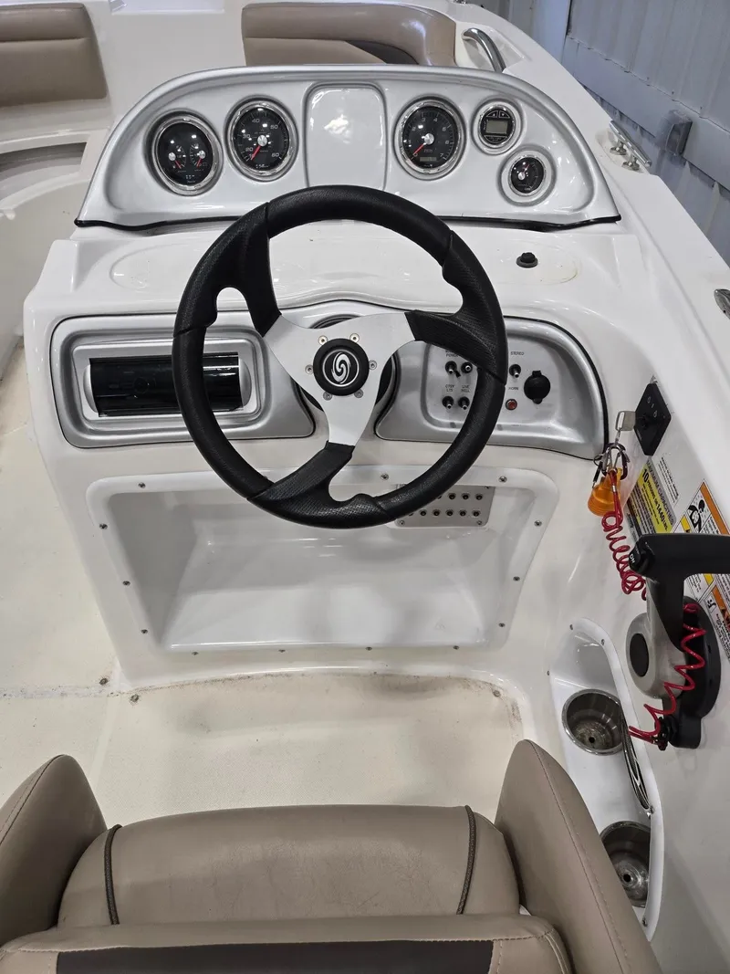 Slide: The Image of Steering console of a 2013 Hurricane SS203-OB boat. - 11