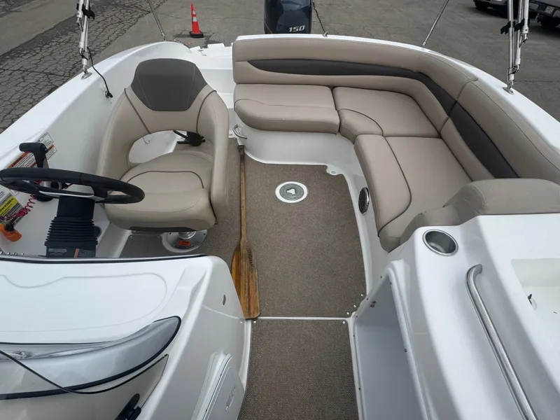 Slide: The Image of Interior of a 2013 Hurricane SS203-OB boat with seating area. - 12