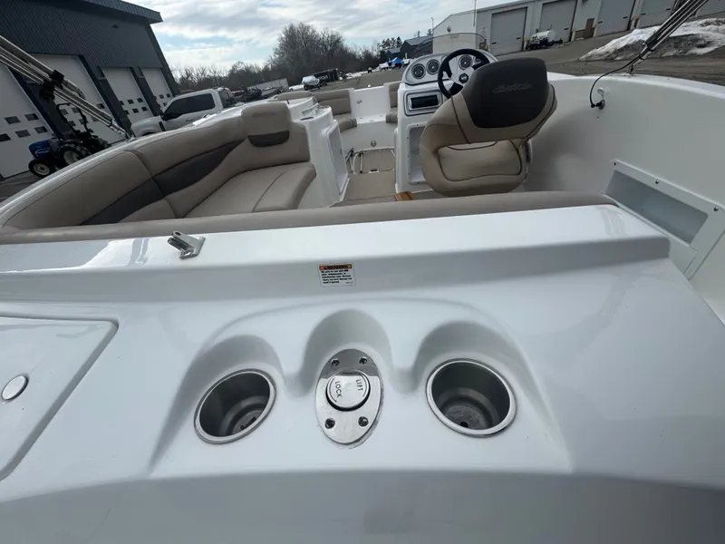 Slide: The Image of Interior view of a 2013 Hurricane SS203-OB boat with steering wheel and seats. - 17