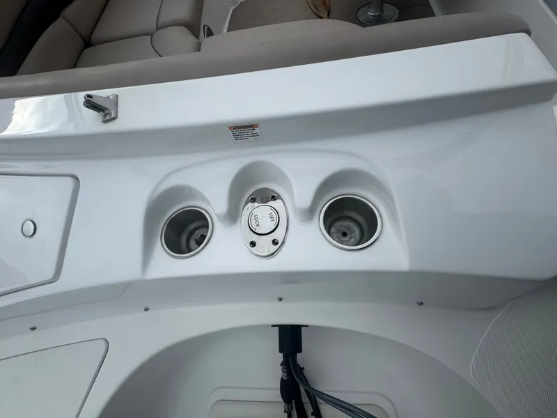 Slide: The Image of Interior view of a 2013 Hurricane SS203-OB boat with cup holders. - 18