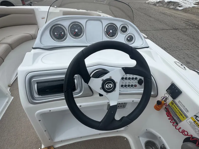 Slide: The Image of Steering console of a 2013 Hurricane SS203-OB boat. - 25