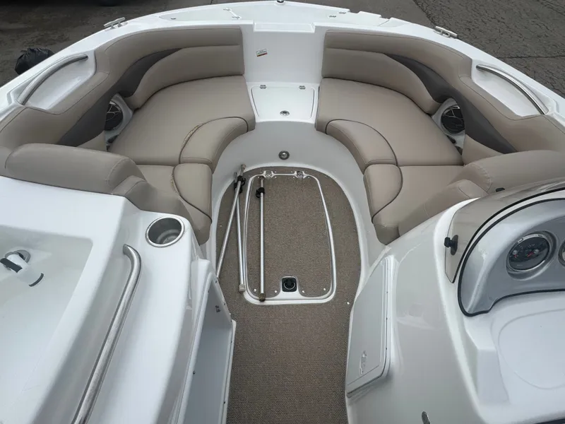 Slide: The Image of Interior of a 2013 Hurricane SS203-OB boat with beige seating. - 26