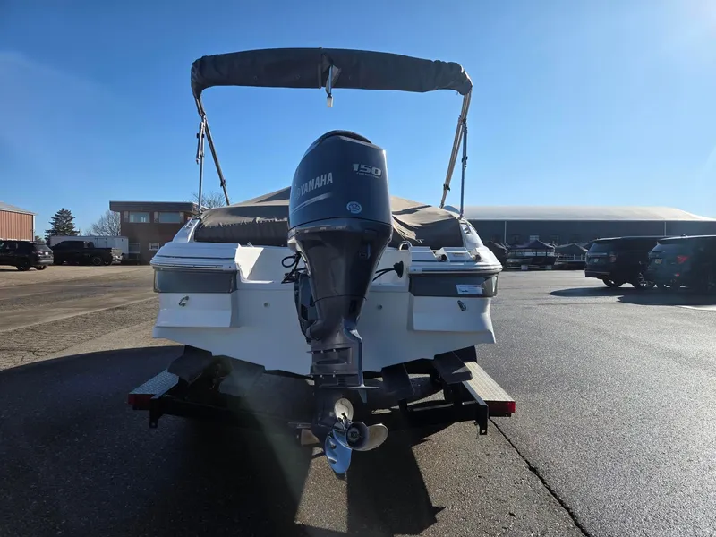 Slide: The Image of 2013 Hurricane SS203-OB boat with Yamaha engine on parking lot. - 4