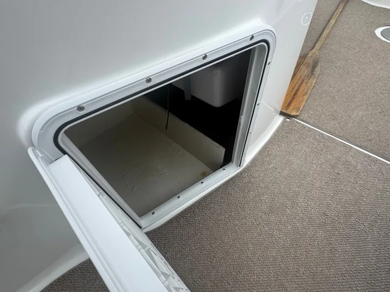 Slide: The Image of Open storage compartment on a 2013 Hurricane SS203-OB boat. - 9