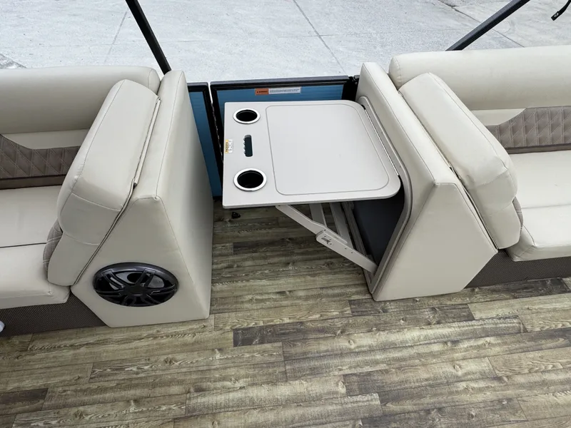 Slide: The Image of Interior of Crest 240 Platinum boat, foldable table with cup holders. - 11