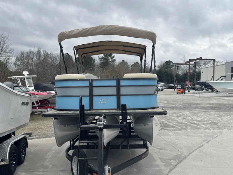 Slide: The Image of 2020 Crest 240 Platinum pontoon boat on a trailer. - 3