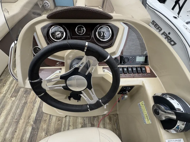 Slide: The Image of Steering console of a 2020 Crest 240 Platinum boat. - 6