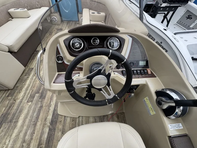 Slide: The Image of Interior view of 2020 Crest 240 Platinum boat with steering console. - 7