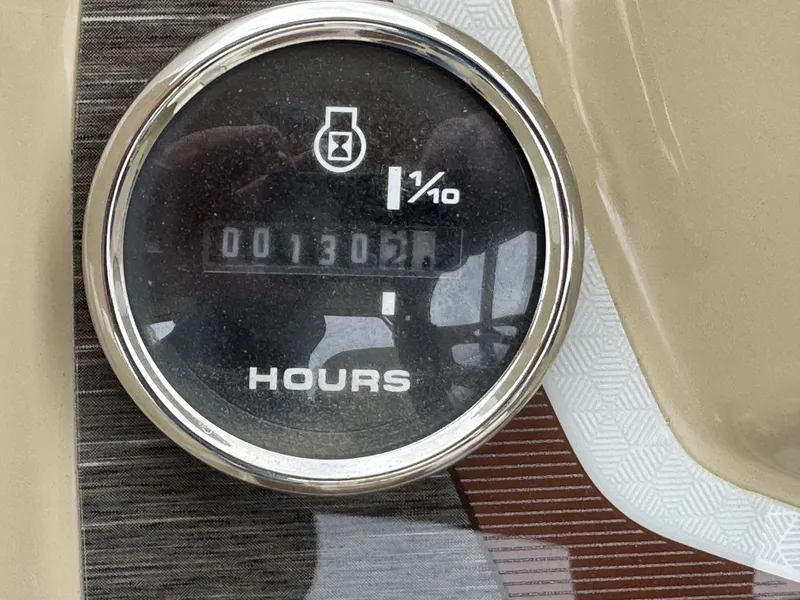 Slide: The Image of Hour meter of a 2020 Crest 240 Platinum showing 130.2 hours. - 8