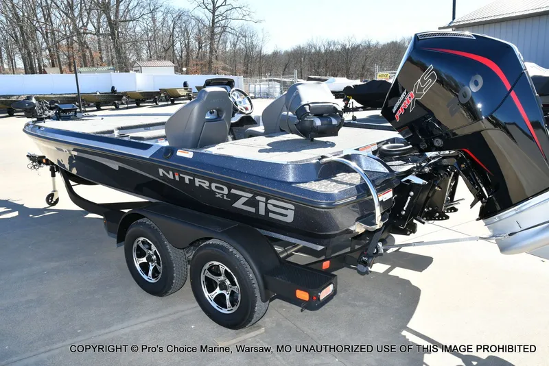 Slide: The Image of 2026 Nitro Z19 XL Pro boat on trailer outdoors. - 24