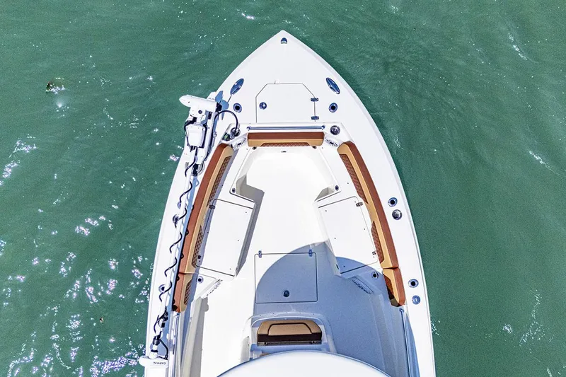 Slide: The Image of Manufacturer Provided Image: 2025 Cobia 265 Center Console Open boat on water, aerial view. - 1