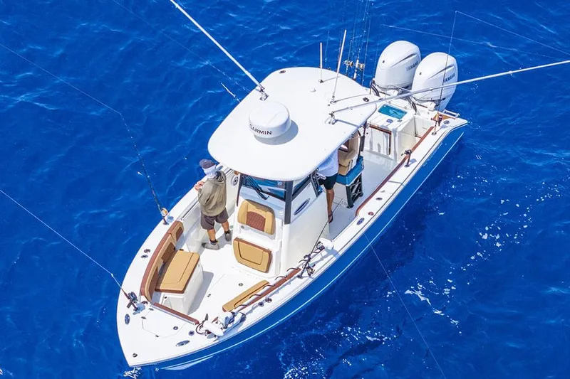 Slide: The Image of Manufacturer Provided Image: 2025 Cobia 265 Center Console Open boat on vibrant blue ocean. - 10