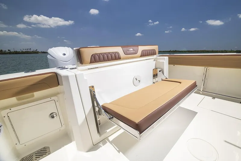 Slide: The Image of Manufacturer Provided Image: 2025 Cobia 265 Center Console Open boat with tan seating and blue sky background. - 19