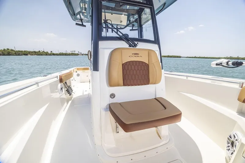 Slide: The Image of Manufacturer Provided Image: 2025 Cobia 265 Center Console Open boat interior on calm water. - 5