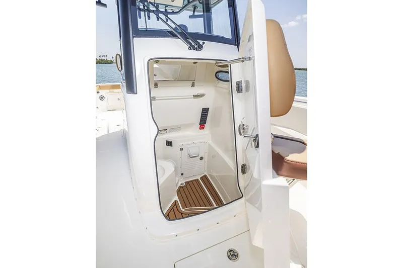 Slide: The Image of Manufacturer Provided Image: 2025 Cobia 265 Center Console Open boat interior with storage and seating. - 6