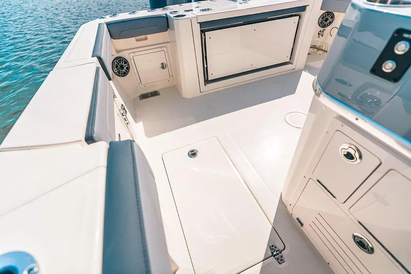 Slide: The Image of Manufacturer Provided Image: 2025 Cobia 285 Open Center Console boat interior with storage and seating. - 17