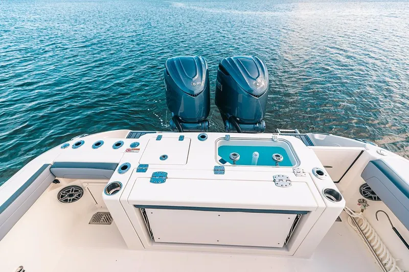 Slide: The Image of Manufacturer Provided Image: 2025 Cobia 285 Open Center Console boat with dual engines on water. - 19
