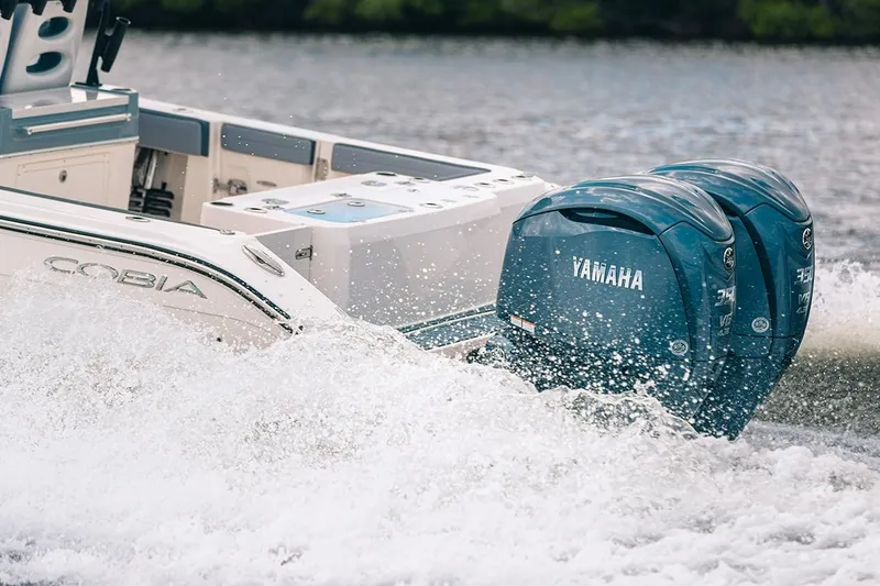 Slide: The Image of Manufacturer Provided Image: 2025 Cobia 285 Open Center Console with Yamaha engines on water. - 7