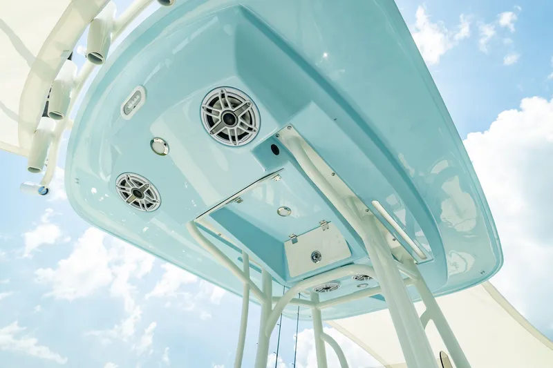 Slide: The Image of Manufacturer Provided Image: Underside view of 2026 Pathfinder 2400 TRS boat with speakers and blue sky background. - 10