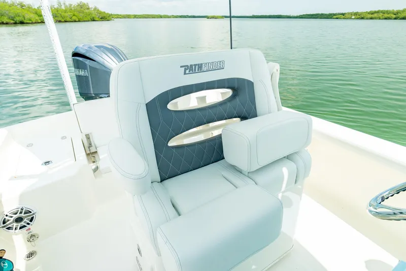 Slide: The Image of Manufacturer Provided Image: 2026 Pathfinder 2400 TRS boat seat with Yamaha engine on calm water. - 11