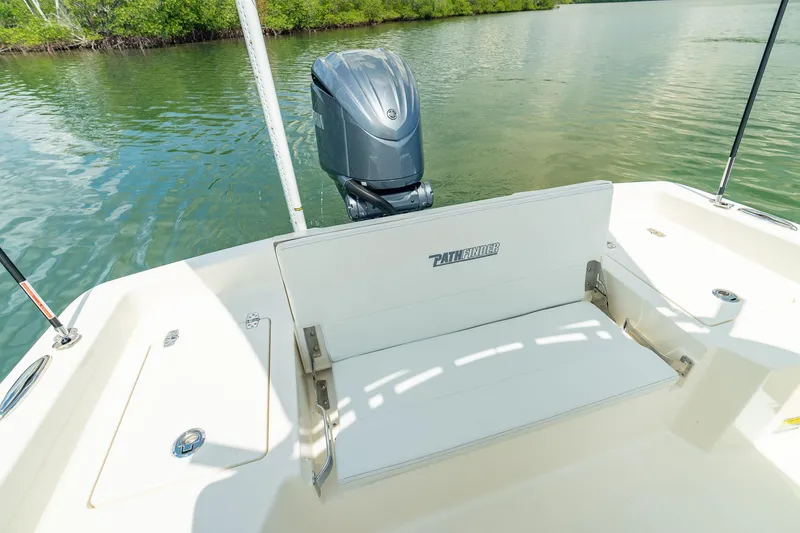 Slide: The Image of Manufacturer Provided Image: 2026 Pathfinder 2400 TRS boat with outboard motor on calm water. - 12