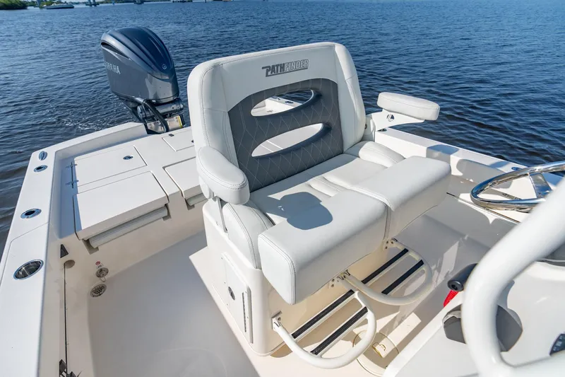 Slide: The Image of Manufacturer Provided Image: 2026 Pathfinder 2600 TRS boat with comfortable seating, on a calm water backdrop. - 11