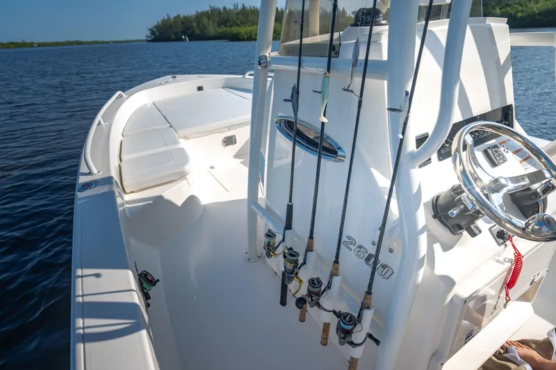 Slide: The Image of Manufacturer Provided Image: 2026 Pathfinder 2600 TRS boat with fishing rods on a calm lake. - 8