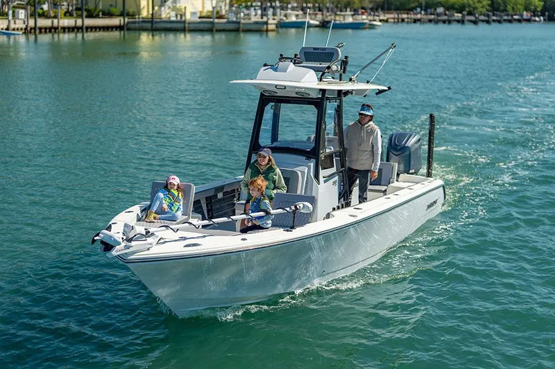 Slide: The Image of Manufacturer Provided Image: 2026 Pathfinder 2800 Hybrid boat cruising with passengers on a sunny day. - 3