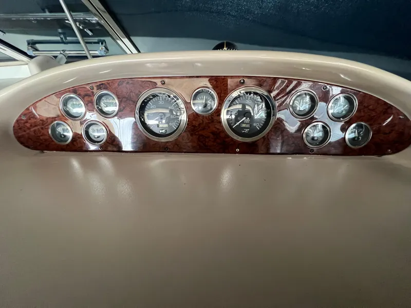 Slide: The Image of Dashboard of a 2001 Sea Ray 340 Amberjack boat. - 10