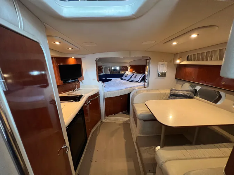Slide: The Image of Interior of 2001 Sea Ray 340 Amberjack with kitchen and sleeping area. - 18