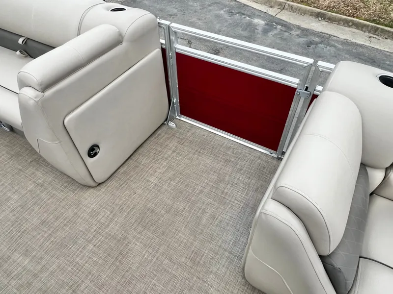 Slide: The Image of Interior of 2024 Sun Tracker 20' PARTY BARGE DLX with beige seating. - 12
