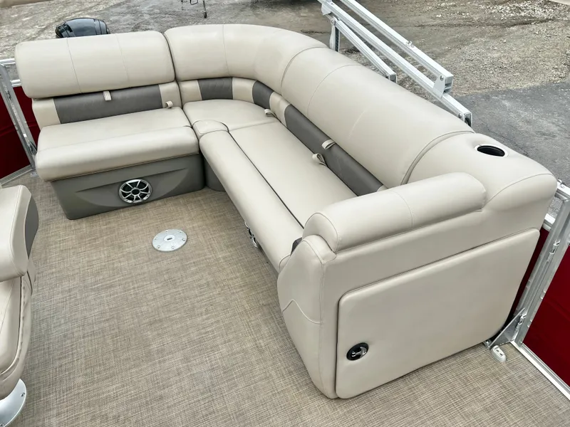 Slide: The Image of Interior of 2024 Sun Tracker 20' PARTY BARGE DLX with beige seating. - 14