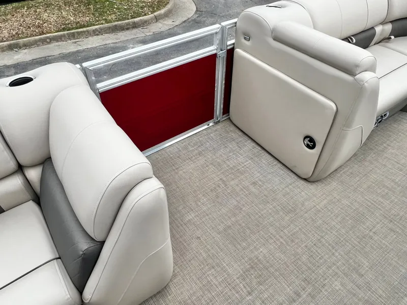 Slide: The Image of Interior of 2024 Sun Tracker 20' PARTY BARGE DLX with beige seating. - 21