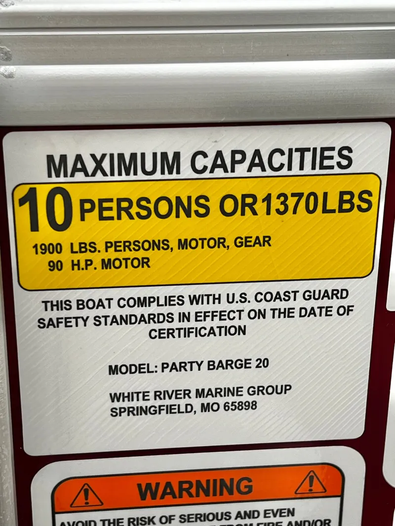 Slide: The Image of Capacity sign for 10 persons or 1370 lbs on Party Barge 20. - 25