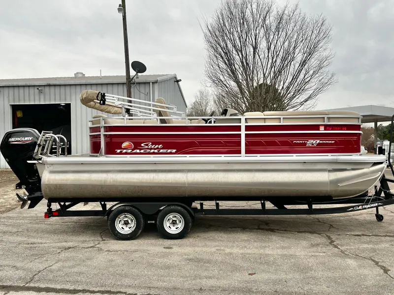Slide: The Image of 2024 Sun Tracker 20' PARTY BARGE DLX pontoon boat on trailer. - 6