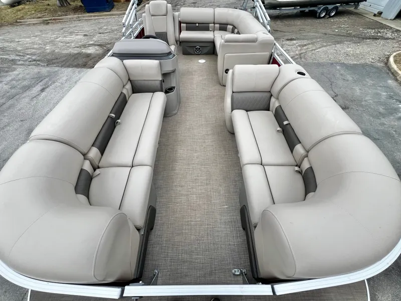 Slide: The Image of Interior of 2024 Sun Tracker 20' PARTY BARGE DLX with beige seating. - 8