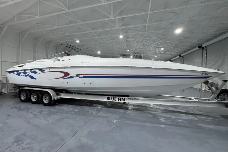Slide: The Image of 2002 Baja .38 Special boat on trailer in indoor storage facility. - 0