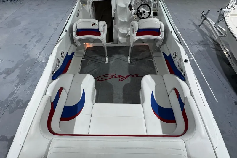 Slide: The Image of 2002 Baja .38 Special boat interior with white, red, and blue seating. - 15