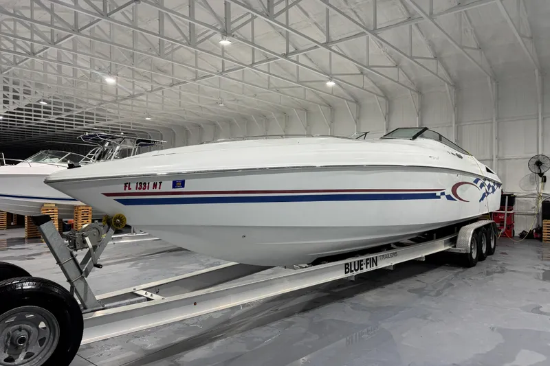 Slide: The Image of 2002 Baja .38 Special boat on trailer in indoor storage facility. - 3