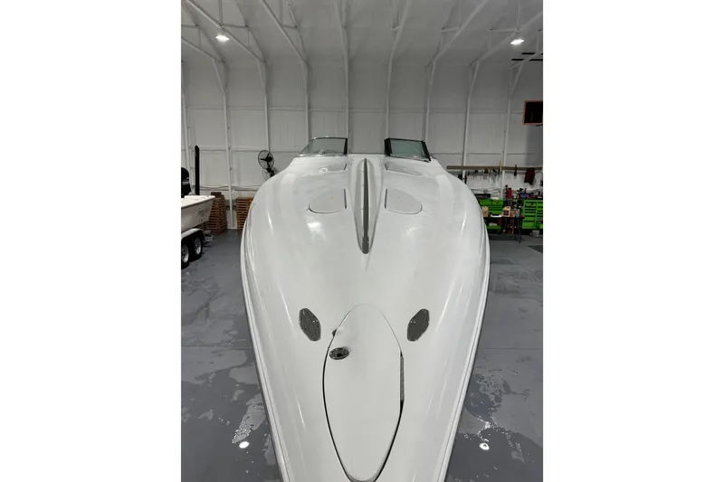 Slide: The Image of 2002 Baja .38 Special boat in a spacious indoor storage facility. - 32
